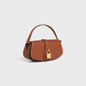 CLUTCH ON STRAP TABOU IN SMOOTH CALFSKIN TAN