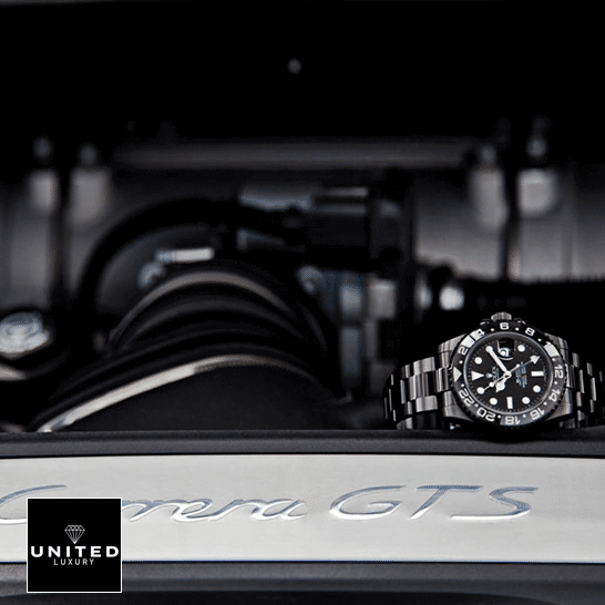 Rolex GMT-Master II 116710 "Blaken DLC-PVD" High-End Replica 1:1 Rolex Blaken GMT-Master II 116710 Black Oyster Replica on the black table